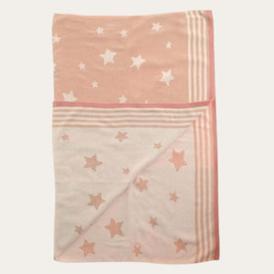 Pink reversible heavy knit baby blanket with contrasting star details.