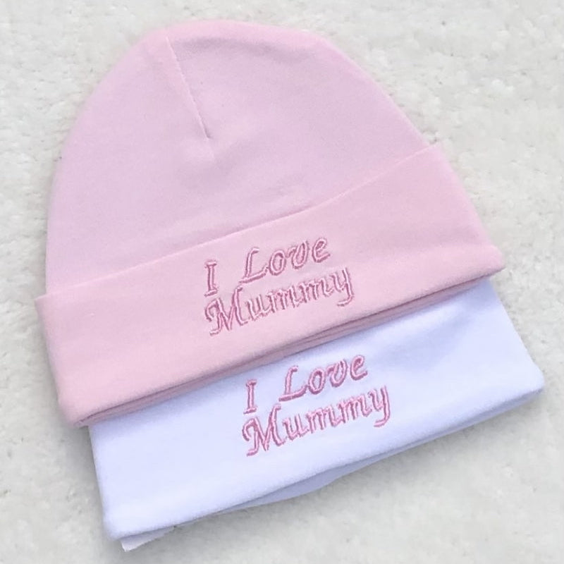 Pink and white baby hats with I Love Mummy embroidery