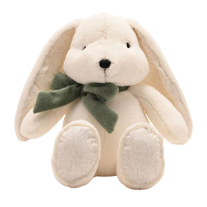 Front view of cream bunny showing floppy ears and patterned paw pads