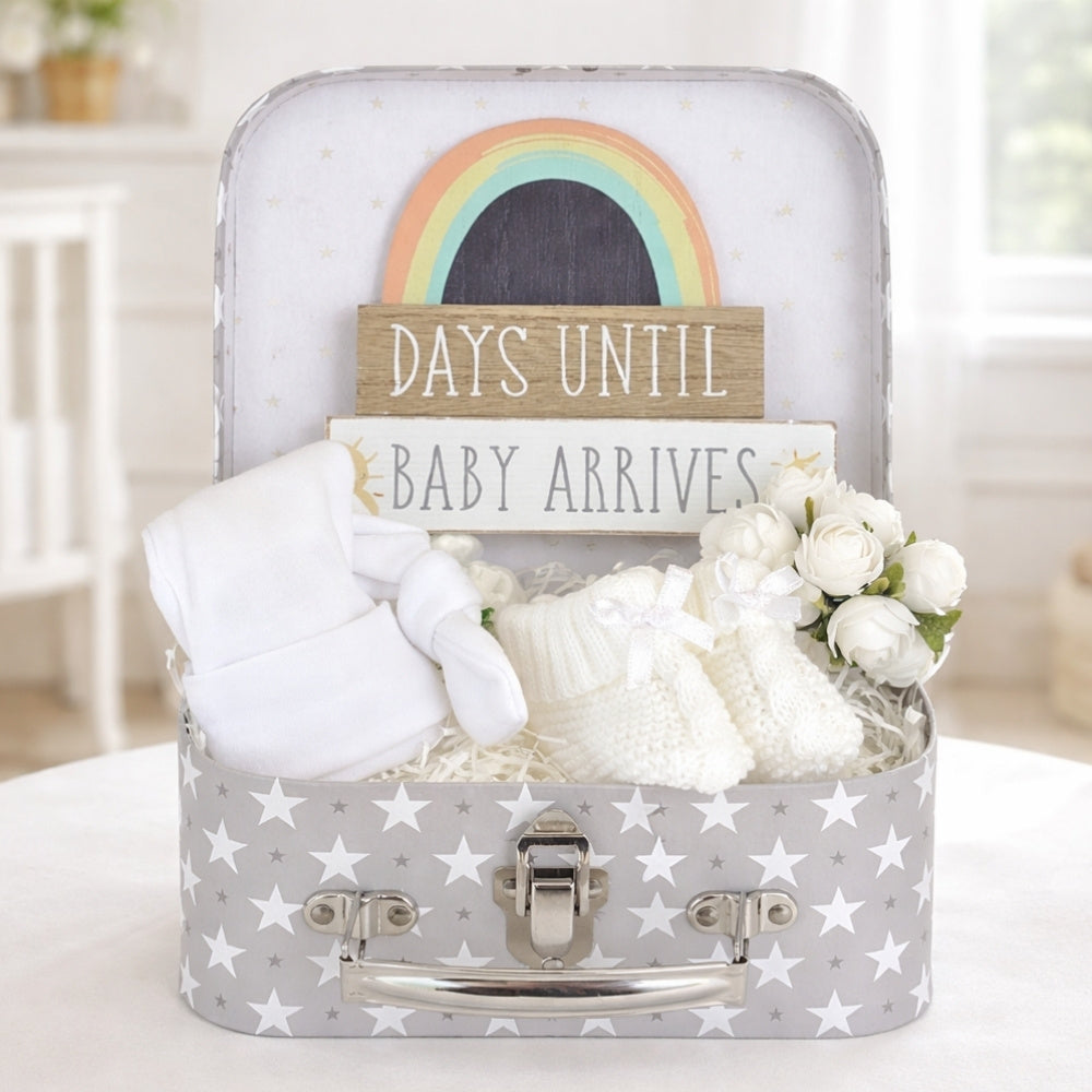 Pregnancy gifts in a luggage suitcase hamper with days until baby arrives nursery plaque