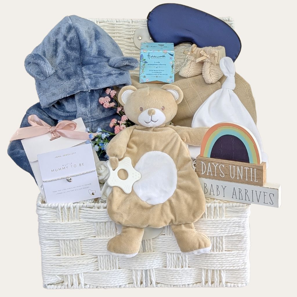 Mum to be gifts hamper with pregnancy presents in a white basket. included countdown and baby items by Bumbles and Boo.
