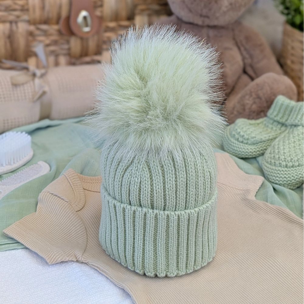 Knitted mint sage green hat with fluffy pompom