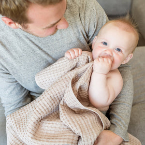 Soft sand-coloured waffle baby blanket – cosy newborn essential