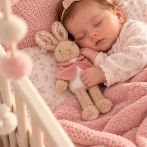 Flopsy bunny soft toy for a baby girl with a velvet dusky pink jacket
