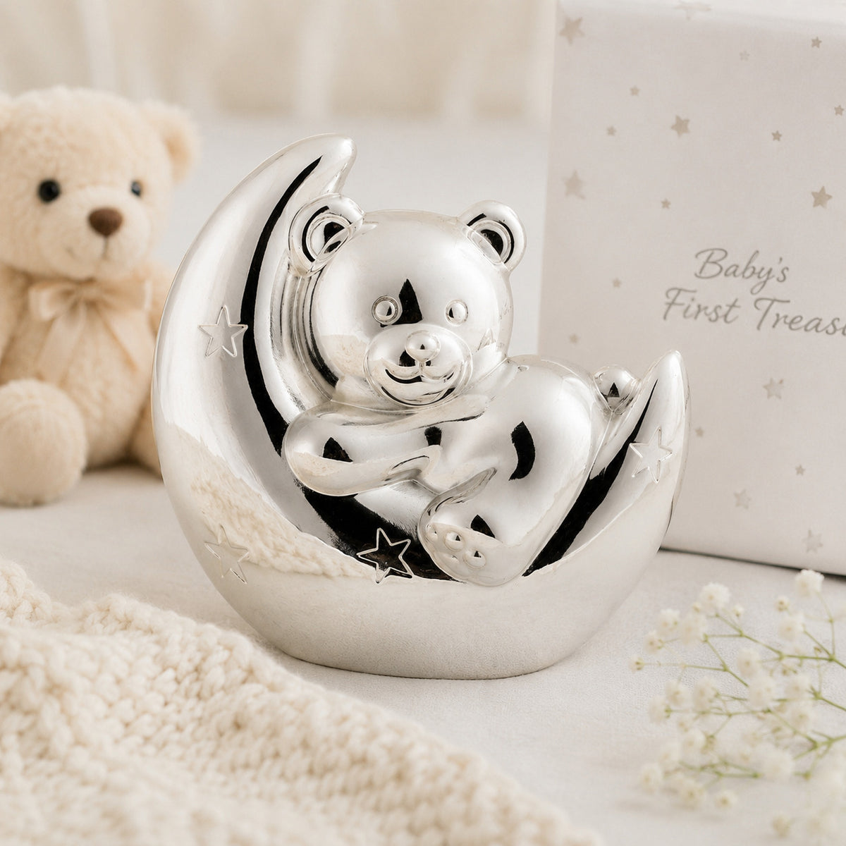 Silver plated money box designed with a teddy bear sitting on a crescent moon
