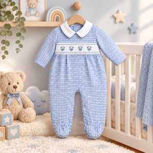Sky blue baby all-in-one with giraffe embroidery and smocking detail