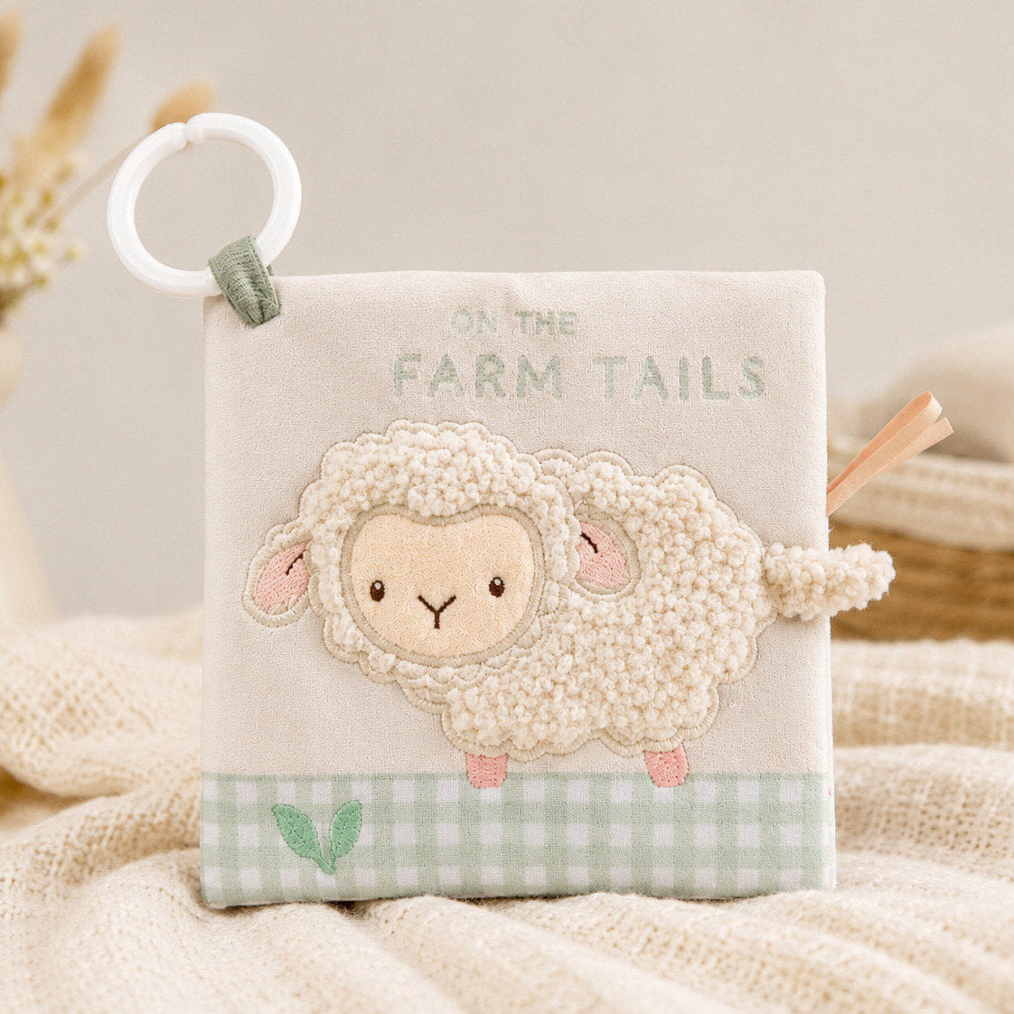 On The Farm soft crinkle baby book featuring Lottie the Lamb a touchy feely tactile sheep on the cover. Clip to attach to the pram