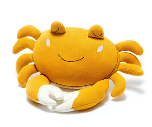 Yellow plush crab toy on a white background