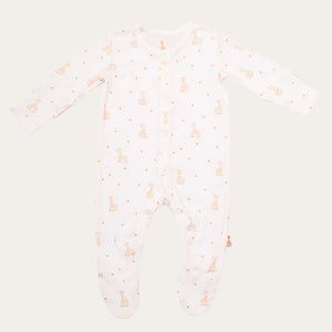 Close up of baby sleepsuit that is part of the Sophie Le Girafe baby gifts set that in a box with a ribbon. Perfect new baby gift. Babygrow is 100% cotton in cream with Sophie La Giraffe print.