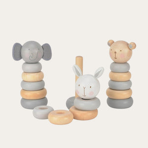 Three stacking ring wooden toys with animal character designs, including an elephant, a bear, and a rabbit, in beige, gray, and white colors.