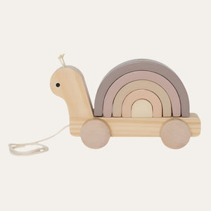 Wooden pull along snail toy with the rainbow stacked neatly.