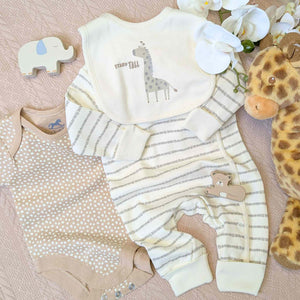 Baby romper with vest and bib in a giraffe theme, beige in colour.