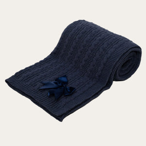 soft and cosy navy blue knit baby blanket with satin bow detail.