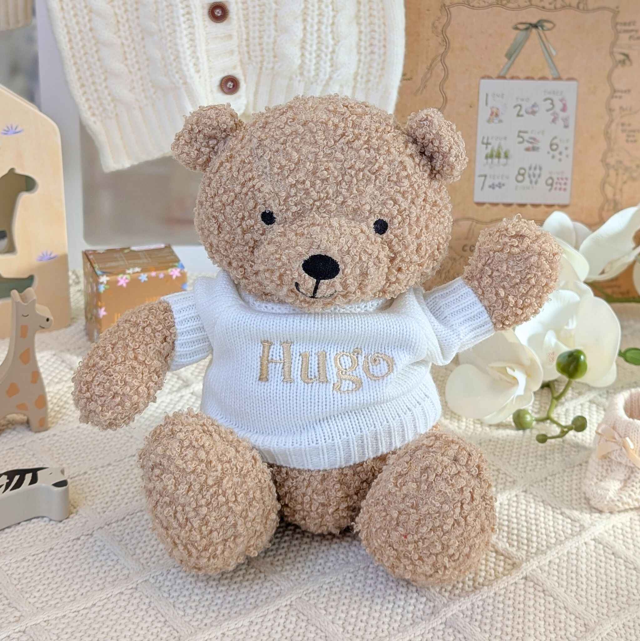Teddy bear wearing a white personalised sweater.