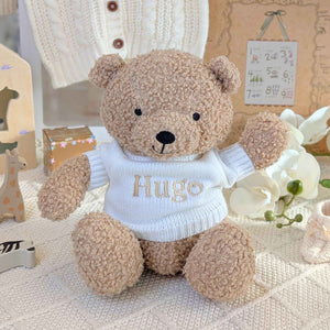 Teddy bear wearing a white personalised sweater.