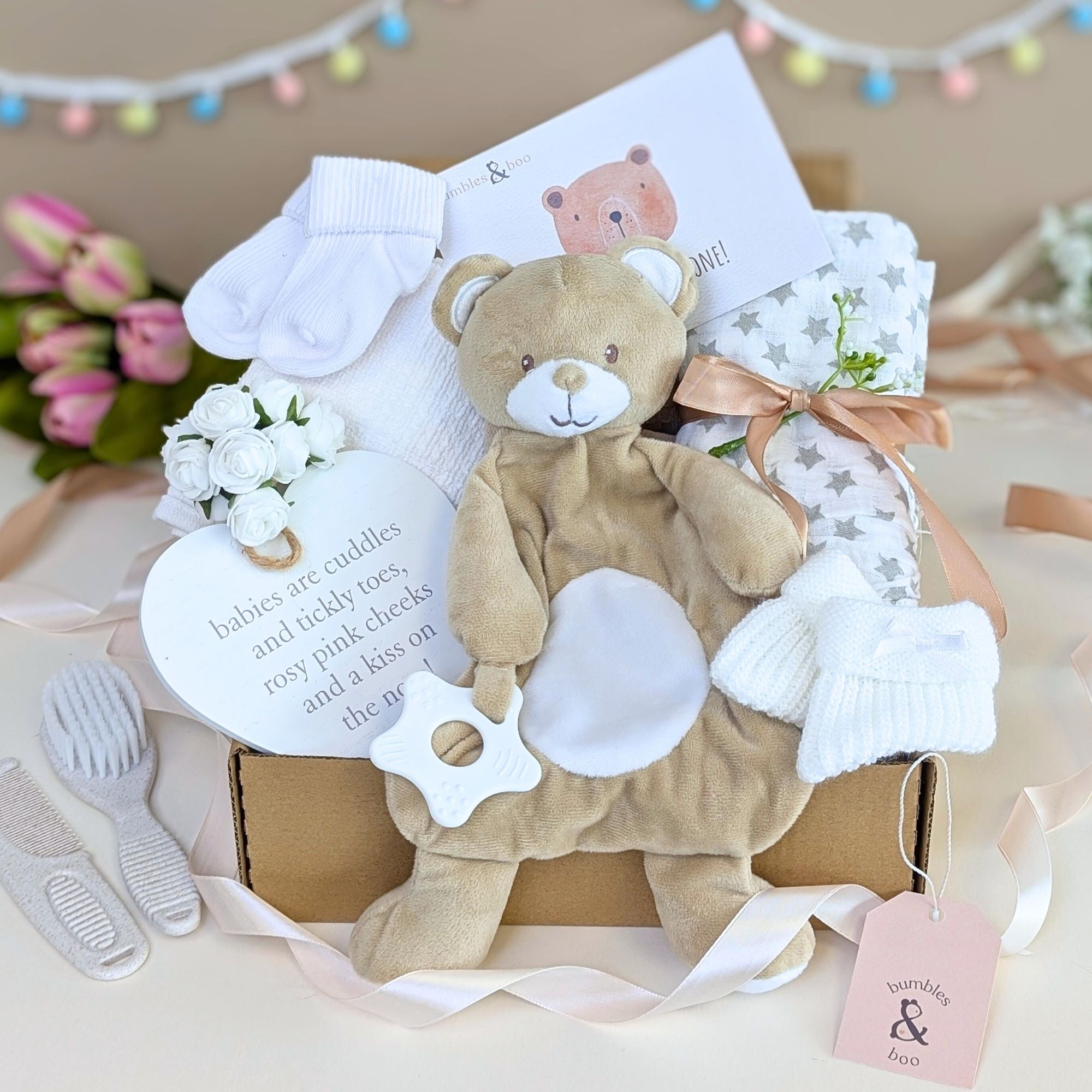 Eco friendly new baby gifts box with bear comforter and teething toy by Bumbles and Boo. Hamper contains baby essentials and presents.