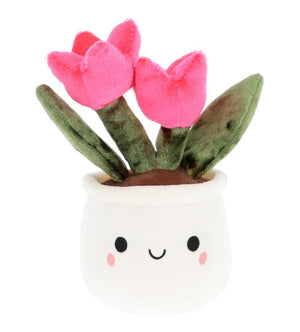 Plush toy resembling a potted tulip plant with pink flowers and a smiling face on a white background
