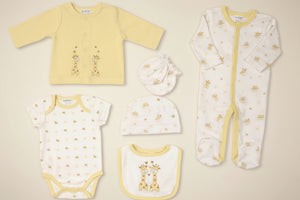 yellow and white baby clothing set with giraffe print