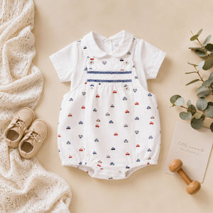 Baby romper with car pattern in white, red and blue