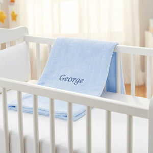 Soft blue baby wrap blanket with vehicle and boat embossed print