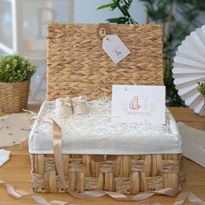 Hamper basket for baby gifts made from water hyacinth.