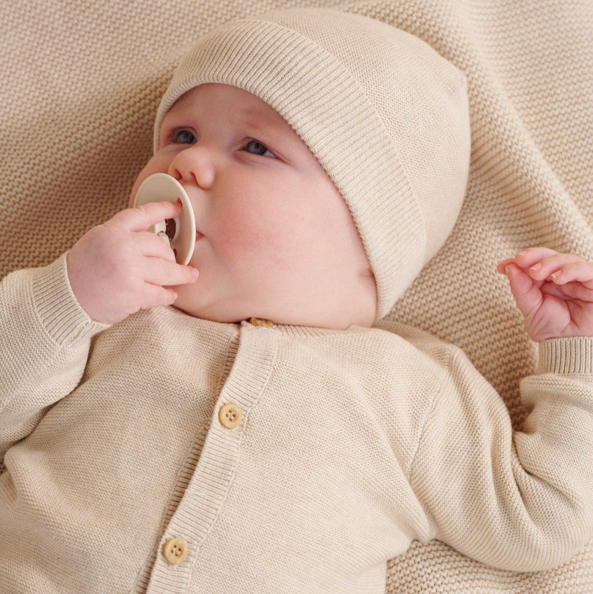 Wheat coloured textured baby cardigan in organic cotton
