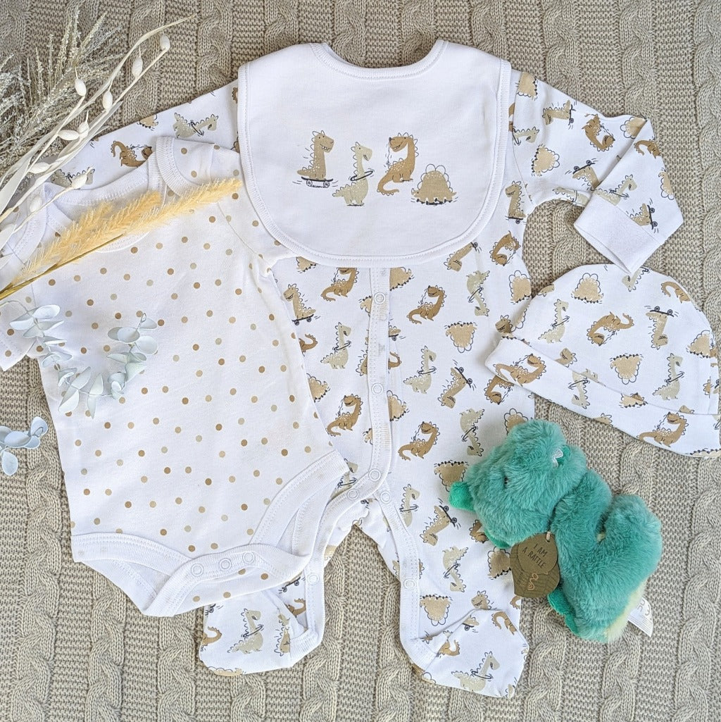 White baby clothes set with a dinosaur pattern