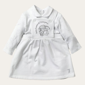 Flatlay of white baby girl dress and white top set