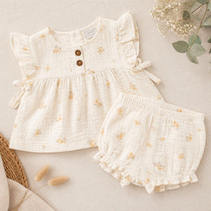 White floral baby girl outfit with frill sleeve top and matching shorts