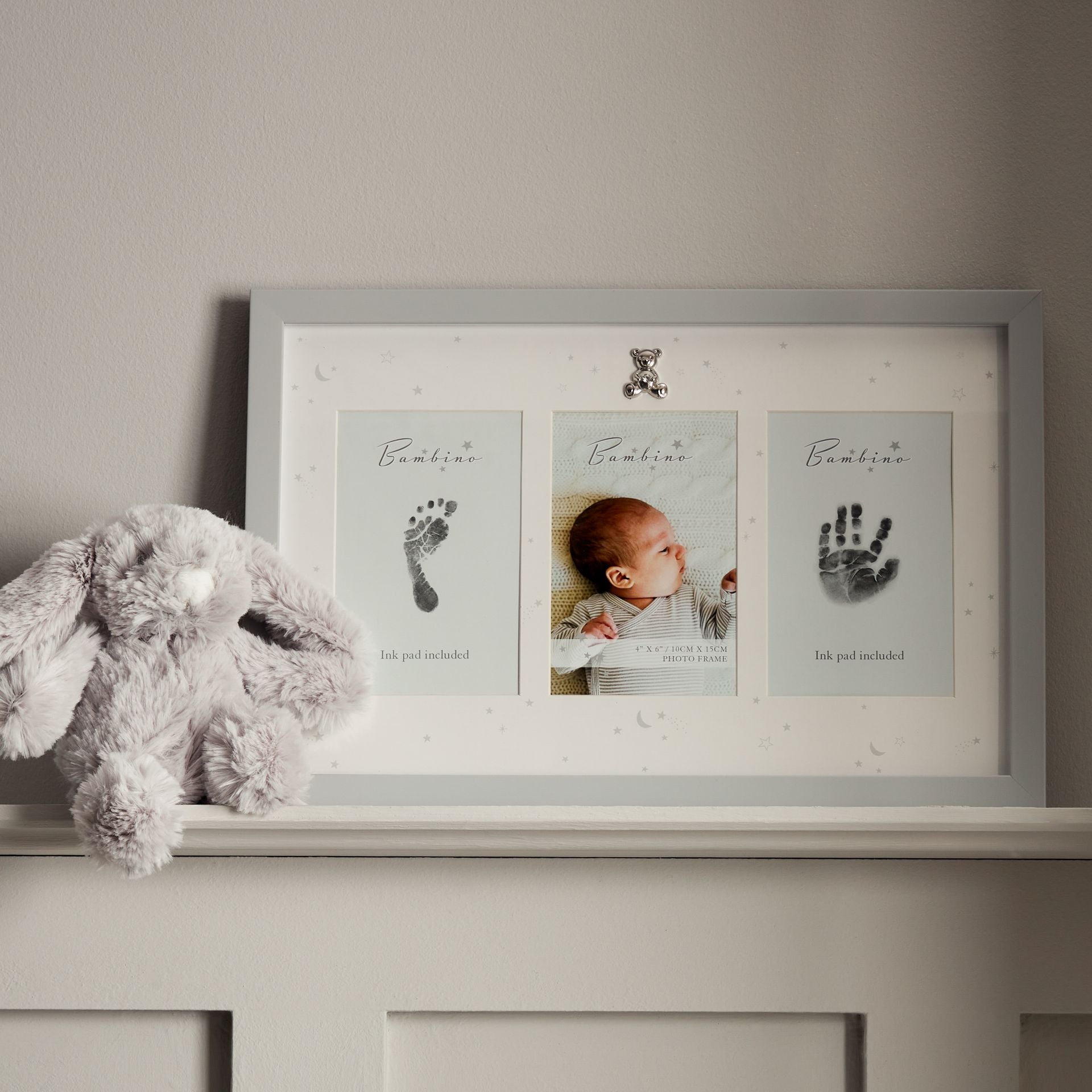 White baby hand and footprint frame with photo and ink pad