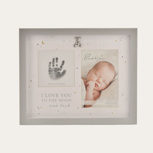 Front view of the white baby photo frame with handprint window and silver-coloured lettering.
