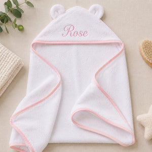 White hooded towel with pink trim and bear ears with the name ROSE emroidered