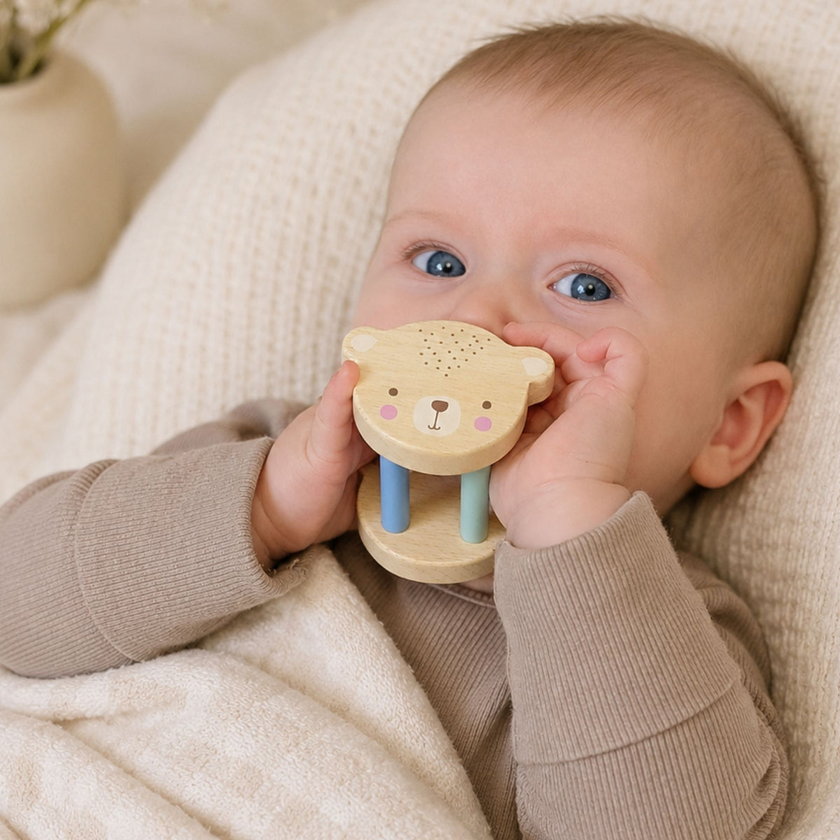Wooden baby rattle with an animal design