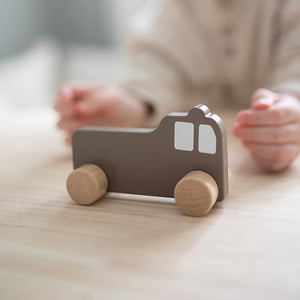 Wooden toy fire engine.