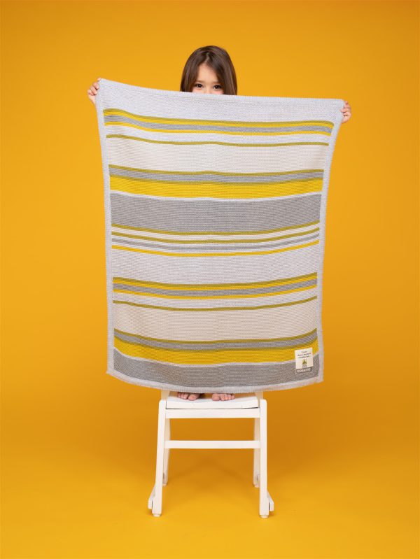 Cosatto baby blanket with grey and yellow stripes on a yellow background