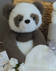 New baby hamper gift with panda bear, baby hat, blanket, booties and bracelet.