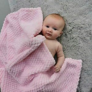 Pink waffle baby blanket.
