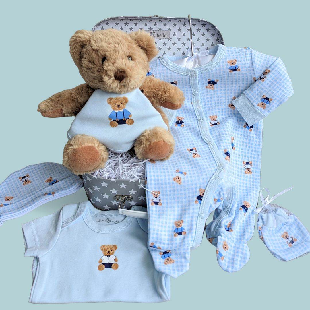 Baby boy clothing set in a lovely keepsake trunk and teddy bear.