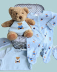 Baby boy clothing set in a lovely keepsake trunk and teddy bear.