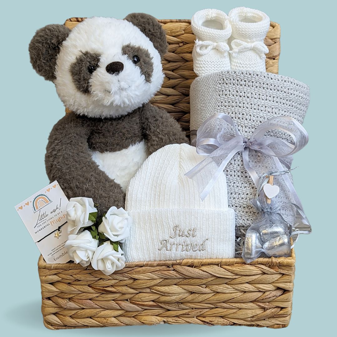 New baby hamper gifts with panda bear, baby hat, blanket, booties and bracelet.