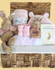 Baby girl gift hamper in pink with Peter Rabbit theme.
