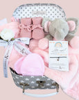 baby girl gifts hamper with pink taggie blanket, scratch mitts, booties, elephant comforter and bracelet.