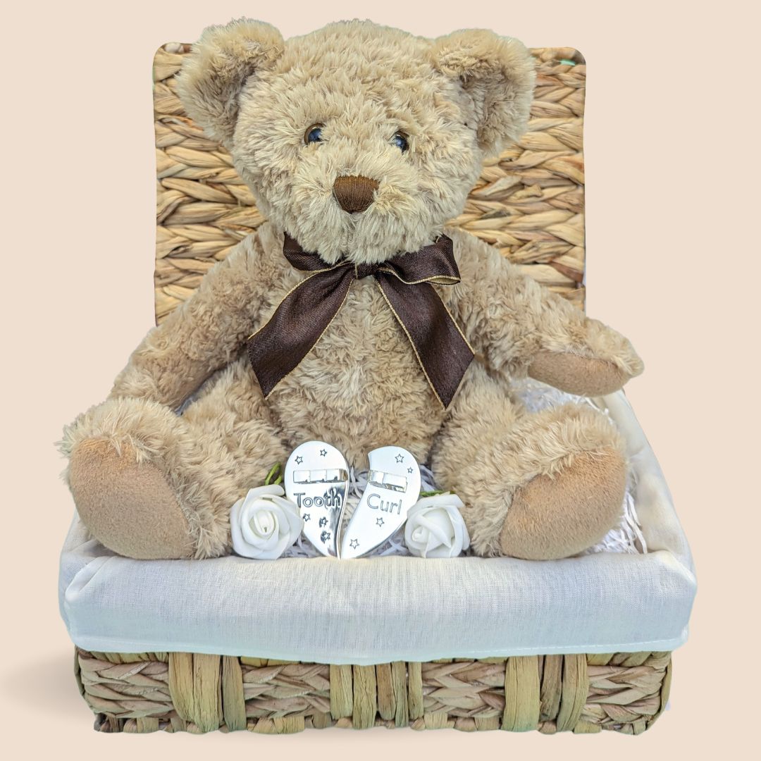 Christening gift with silver plated first tooth and curl trinket box and traditional teddy bear.