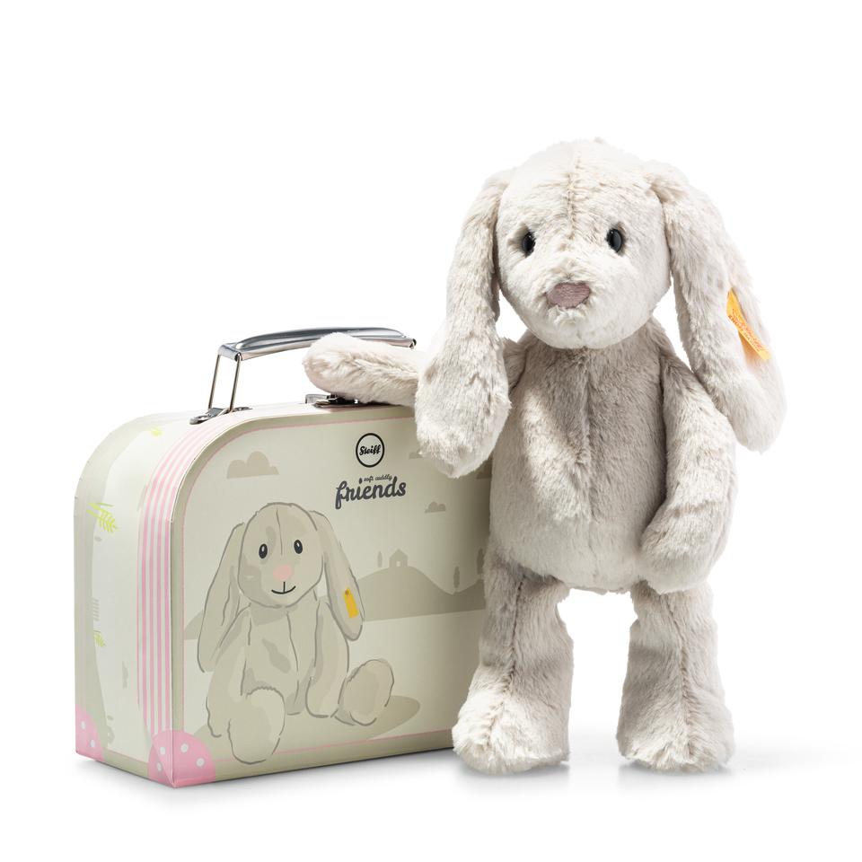 This grey Hoppie rabbit is perfect for children who like to cuddle. This cute little rabbit is 26 cm tall and has a brass-plated "Button in Ear". He is made of cuddly soft plush, and has his own suitcase.