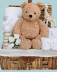 new baby gift basket with steiff teddy bear, sophie la giraffe teething toy and cellular baby blanket.