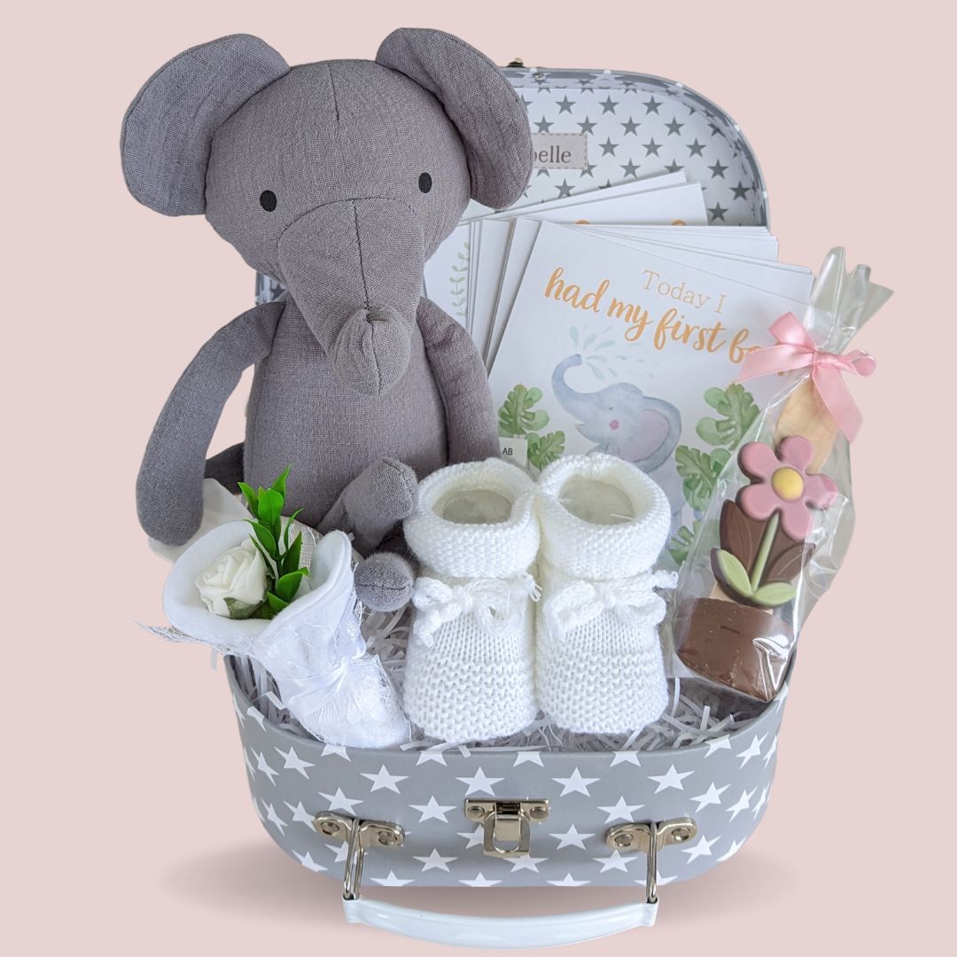 New mum hamper gift with organic elephant, milestone cards, baby booties and mittens and chocolate for mum.