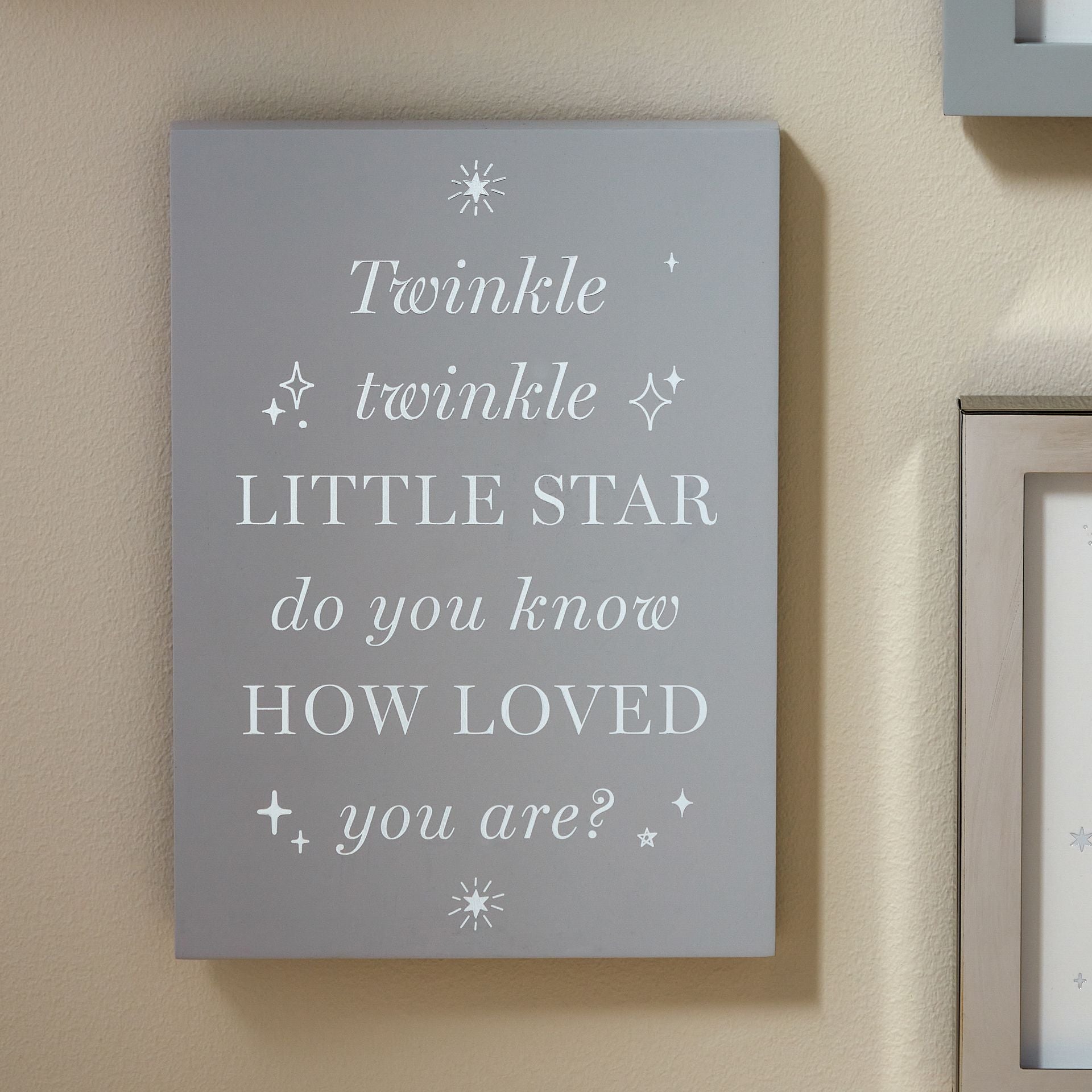 Grey matt plaque which can be hung on the wall or free standing with the words twinkle twinkle little star, do you know how loved you are?