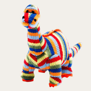 Rainbow Striped Knitted Diplodocus Dinosaur Rattle for a baby.