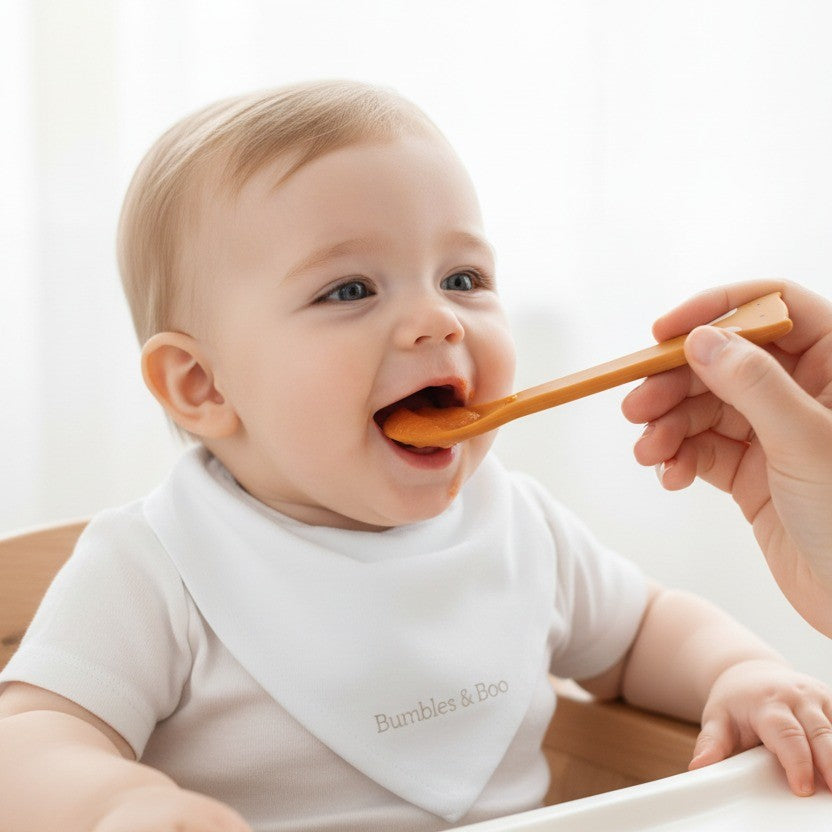 Baby being fed with a spoon during weaning
