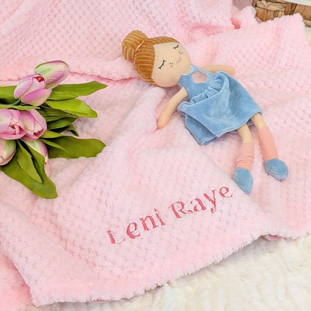 Personalised baby girl gifts, this blanket is a soft pink waffle with a custom name ‘Leni Raye’ embroidered across this gift